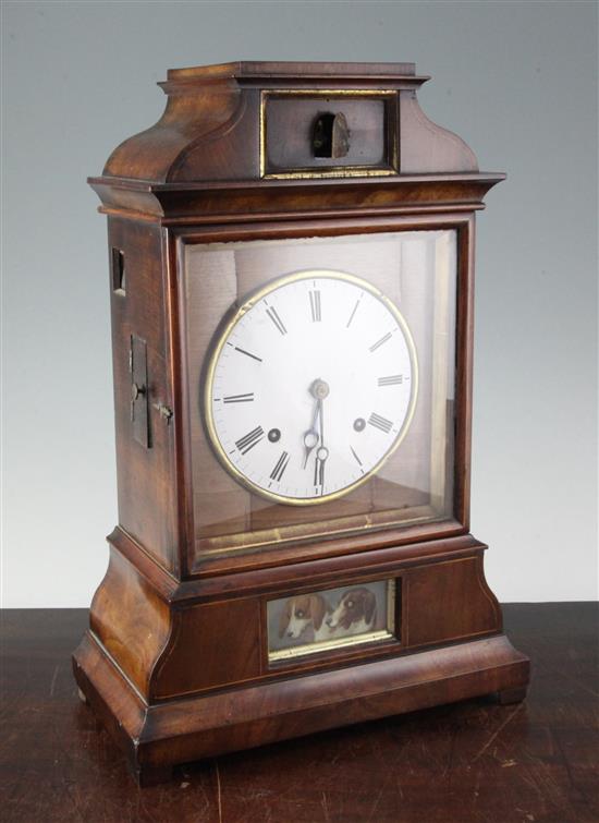 A 19th century Black Forest mahogany mantel clock with automaton and cuckoo, 17.5in.